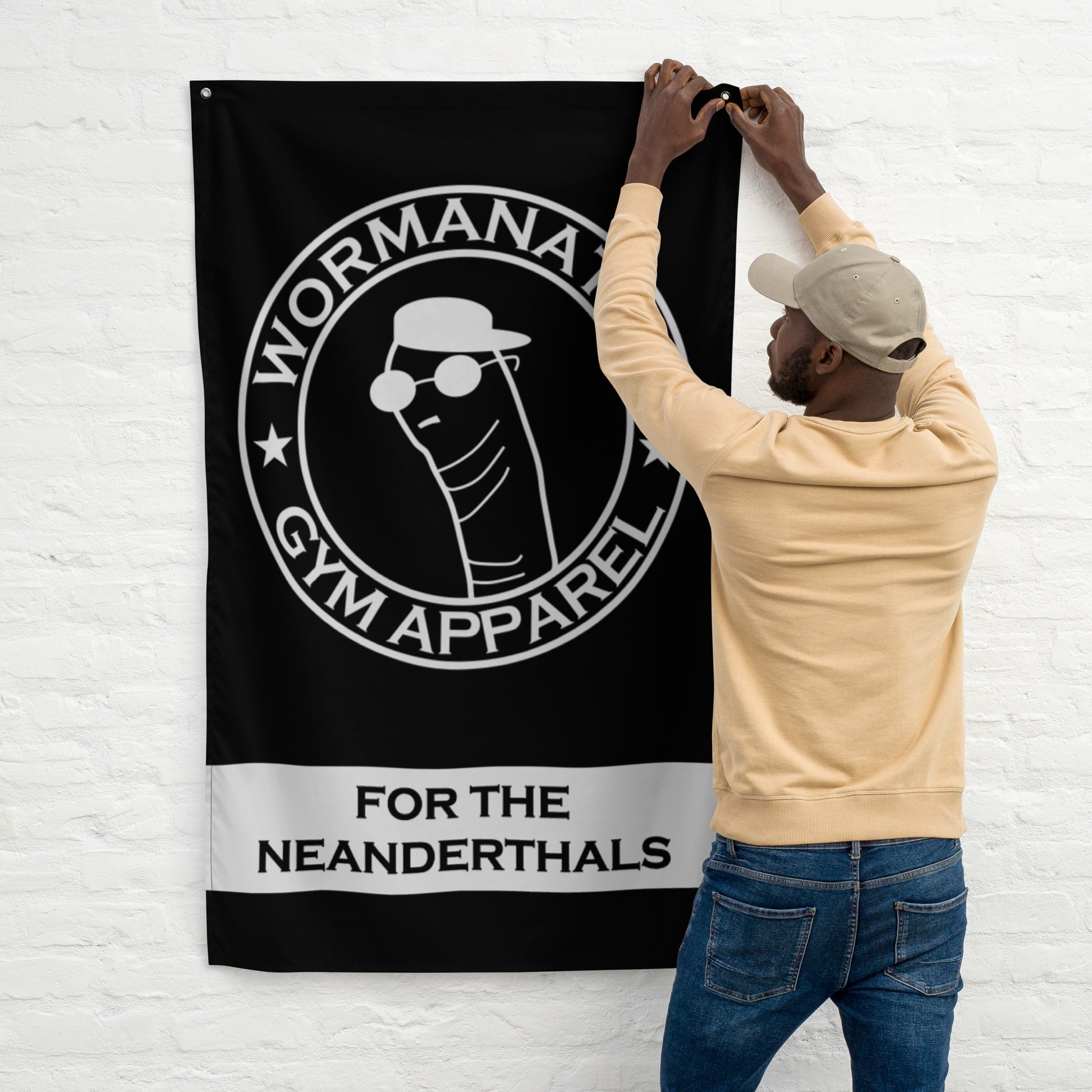 Man proudly hangs a Wormanator Gym Apparel Flag - For the Neanderthals